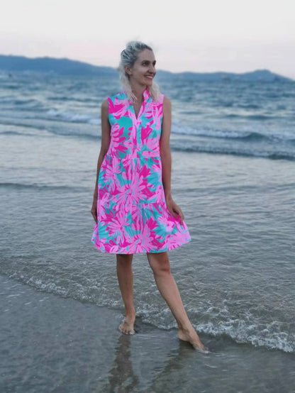 Woman standing on a beach, wearing the Summer Beach Swim Dress made from versatile swimsuit fabric, ideal for seamless day-to-night transitions.