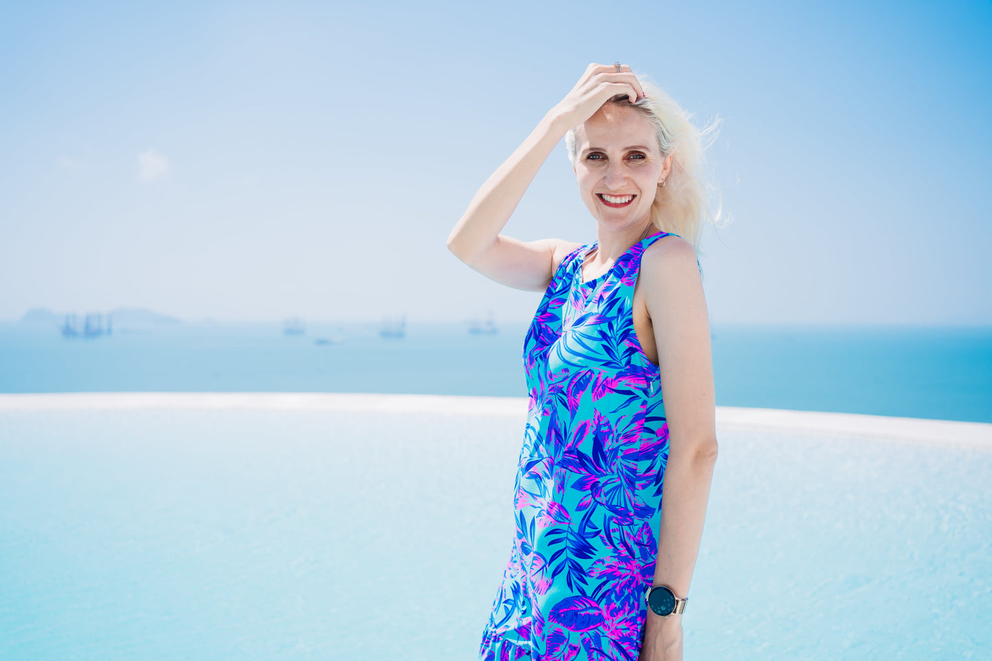 Woman in a Summer Beach Dress standing by a pool, showcasing the dress's comfort and versatility for beach or evening wear.