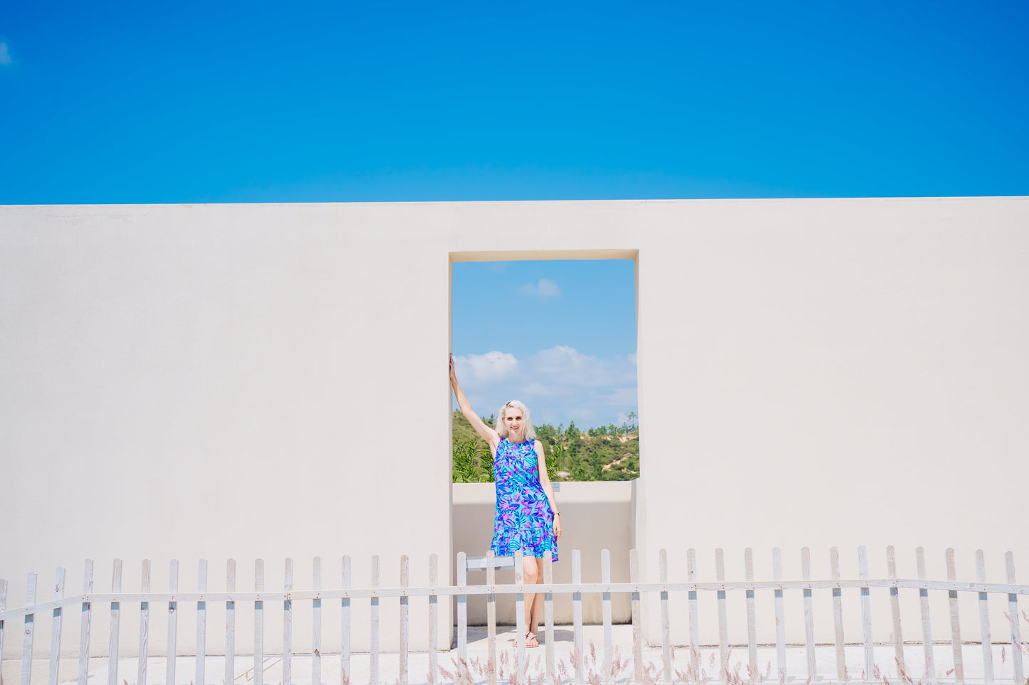 Woman in a Summer Beach Dress standing by a pool, showcasing the dress's comfort and versatility for beach or evening wear.