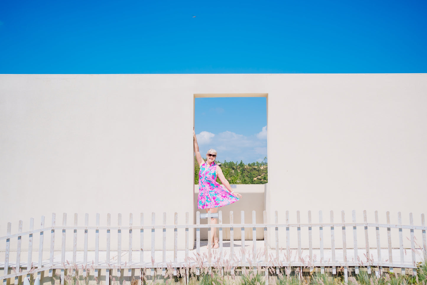 Woman in a Summer Beach Dress standing by a pool, showcasing the dress's comfort and versatility for beach or evening wear.