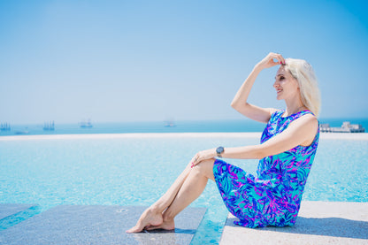 Woman in a Summer Beach Dress standing by a pool, showcasing the dress's comfort and versatility for beach or evening wear.