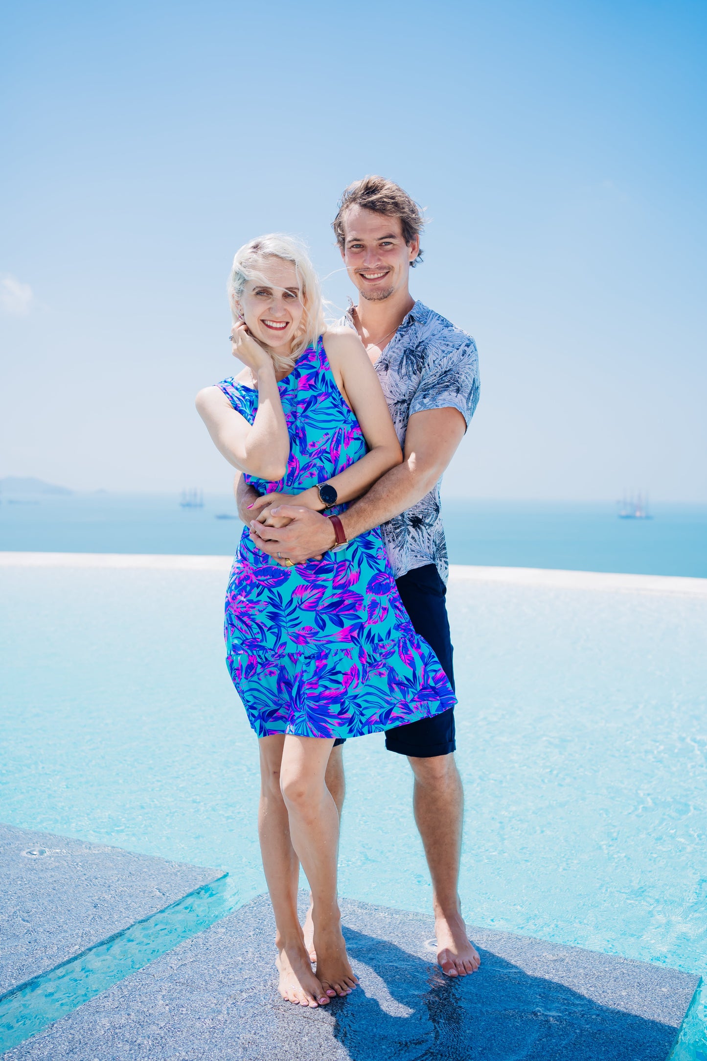 Woman in a Summer Beach Dress standing by a pool, showcasing the dress's comfort and versatility for beach or evening wear.